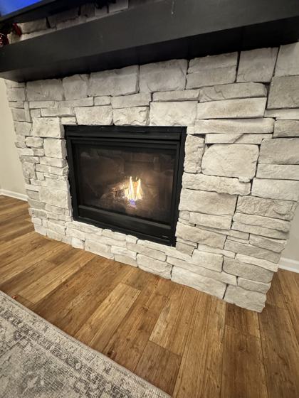 Fireplace and trim work by OnCall Home Co.
