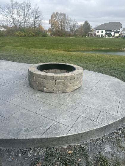 Outdoor kitchen and fire pit work by OnCall Home Co.