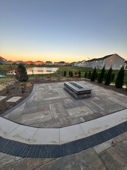 Outdoor kitchen and fire pit work by OnCall Home Co.