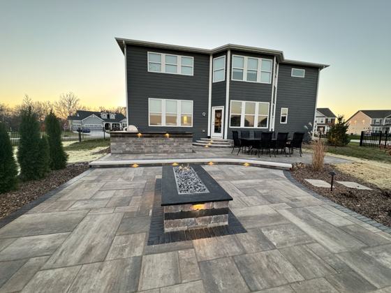 Outdoor kitchen and fire pit work by OnCall Home Co.