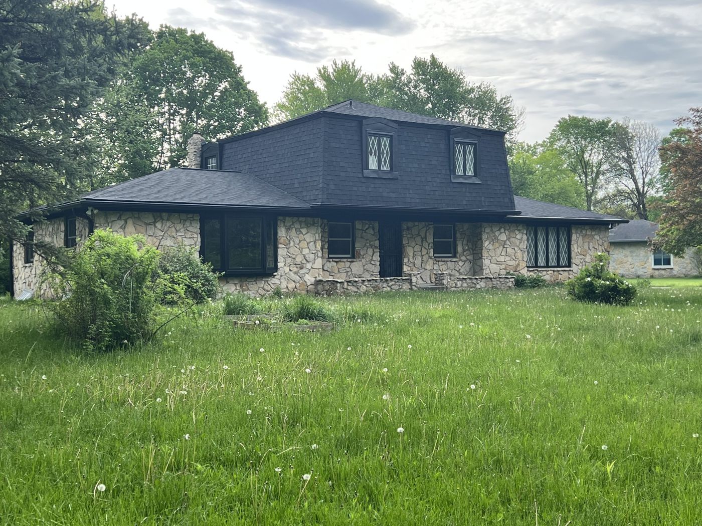 The same side elevation after the mansard and siding were repainted