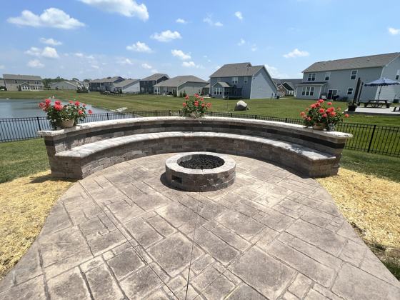 Outdoor kitchen and fire pit work by OnCall Home Co.