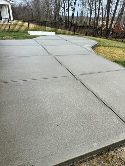 Stamped concrete patio work by OnCall Home Co.