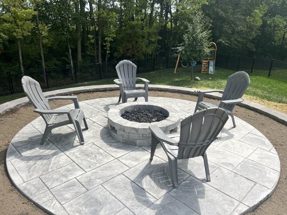 Outdoor kitchen and fire pit work by OnCall Home Co.