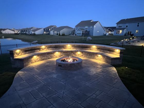 Outdoor kitchen and fire pit work by OnCall Home Co.