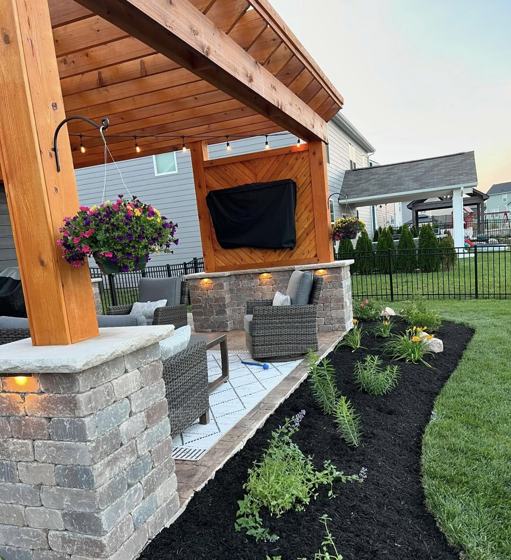 Outdoor kitchen and fire pit work by OnCall Home Co.