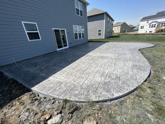 Stamped concrete patio work by OnCall Home Co.