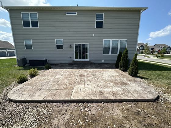 Stamped concrete patio work by OnCall Home Co.