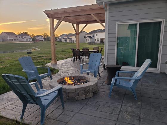 Outdoor kitchen and fire pit work by OnCall Home Co.