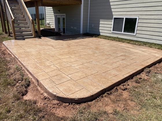 Stamped concrete patio work by OnCall Home Co.
