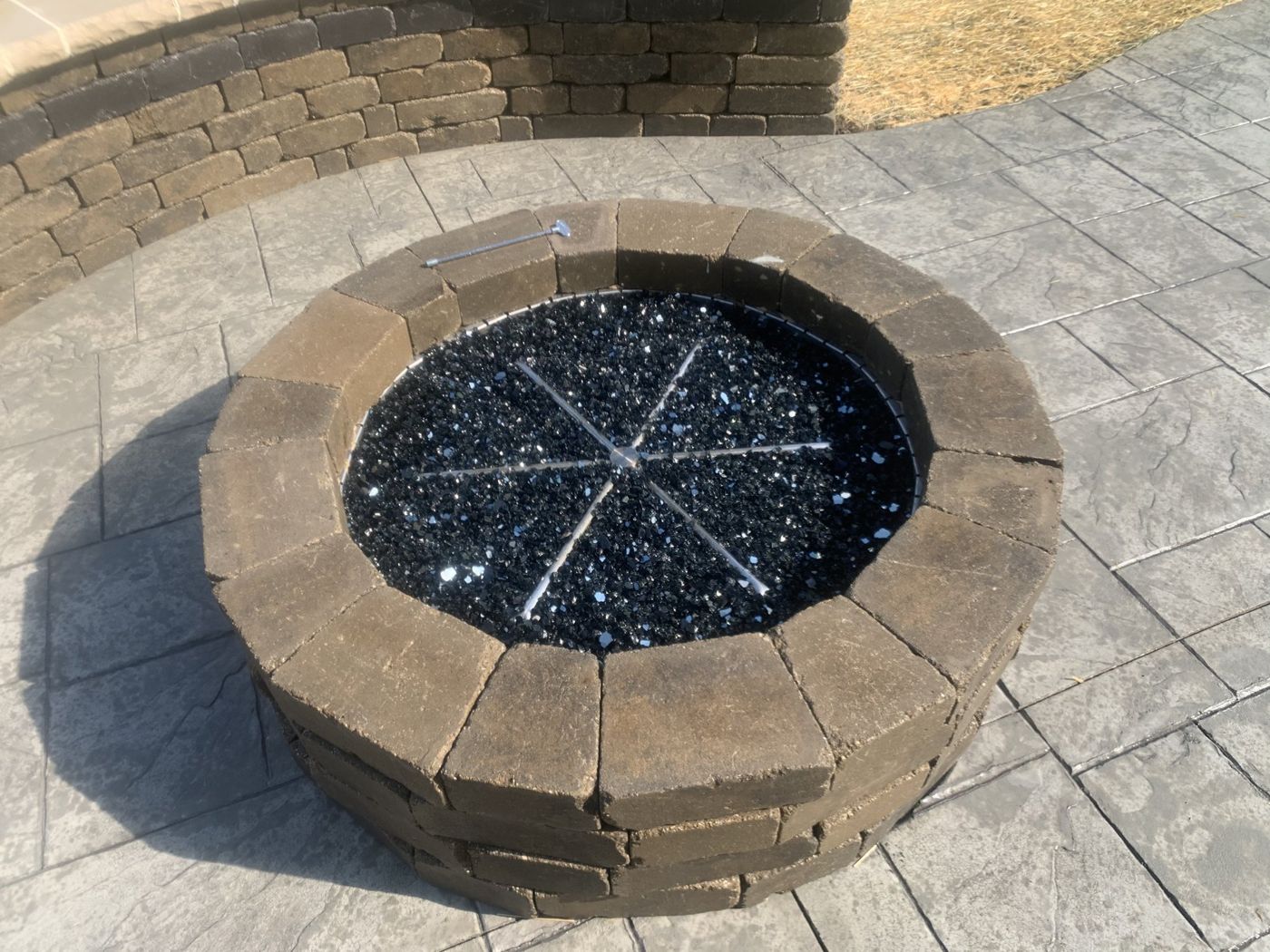 Outdoor kitchen and fire pit work by OnCall Home Co.