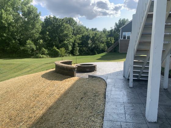 Outdoor kitchen and fire pit work by OnCall Home Co.