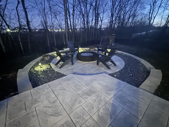 Outdoor kitchen and fire pit work by OnCall Home Co.