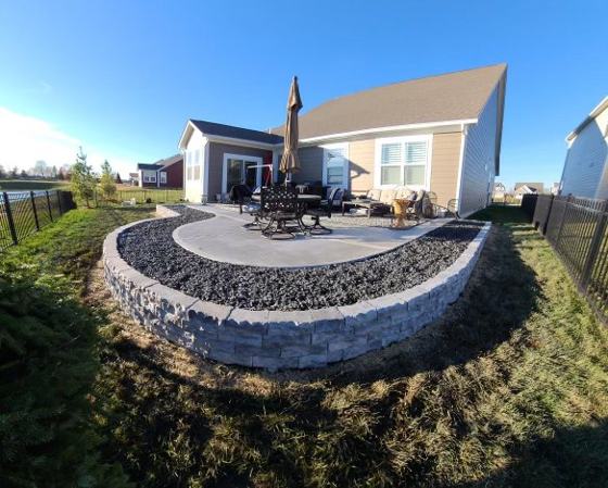 Outdoor kitchen and fire pit work by OnCall Home Co.