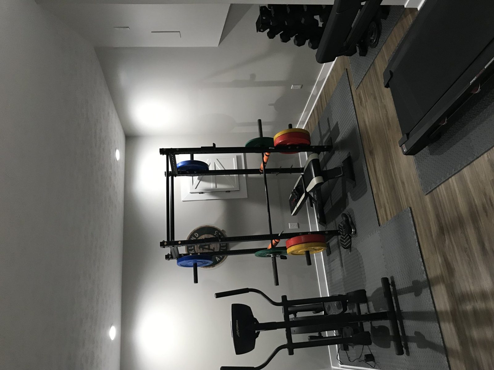 Finished garage with wall mounted storage and equipment racks