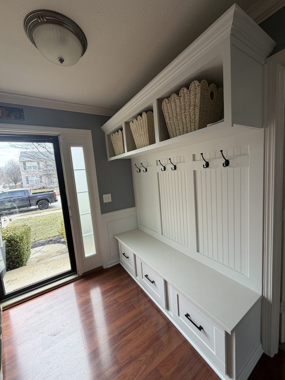 Built in mudroom bench with hooks, cubbies and drawers
